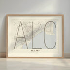 Framed Alacant in Ultralight design, a minimalist aesthetic combining urban cartography with modern, extra-thin elegant lettering designed in light brown and an off-white background with a white margin border in a warm lit minimalist setting