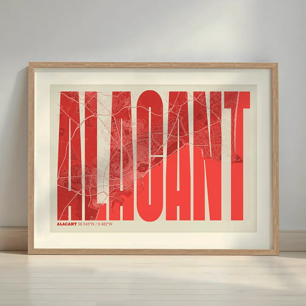Framed Alacant in Extra Compressed design, where the letters are tightly squeezed to fit the city's map shape designed in red and an off-white background with a white margin border in a warm lit minimalist setting