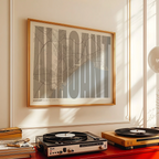 Modern interior design with a Alacant in Extra Compressed design, where the letters are tightly squeezed to fit the city's map shape designed in light brown and an off-white background, displayed on a living room wall