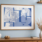 Modern interior design with a Alicante in Inseparable design, featuring the city's abbreviation in expressive typography over a detailed urban map designed in navy blue and white, displayed on a living room wall