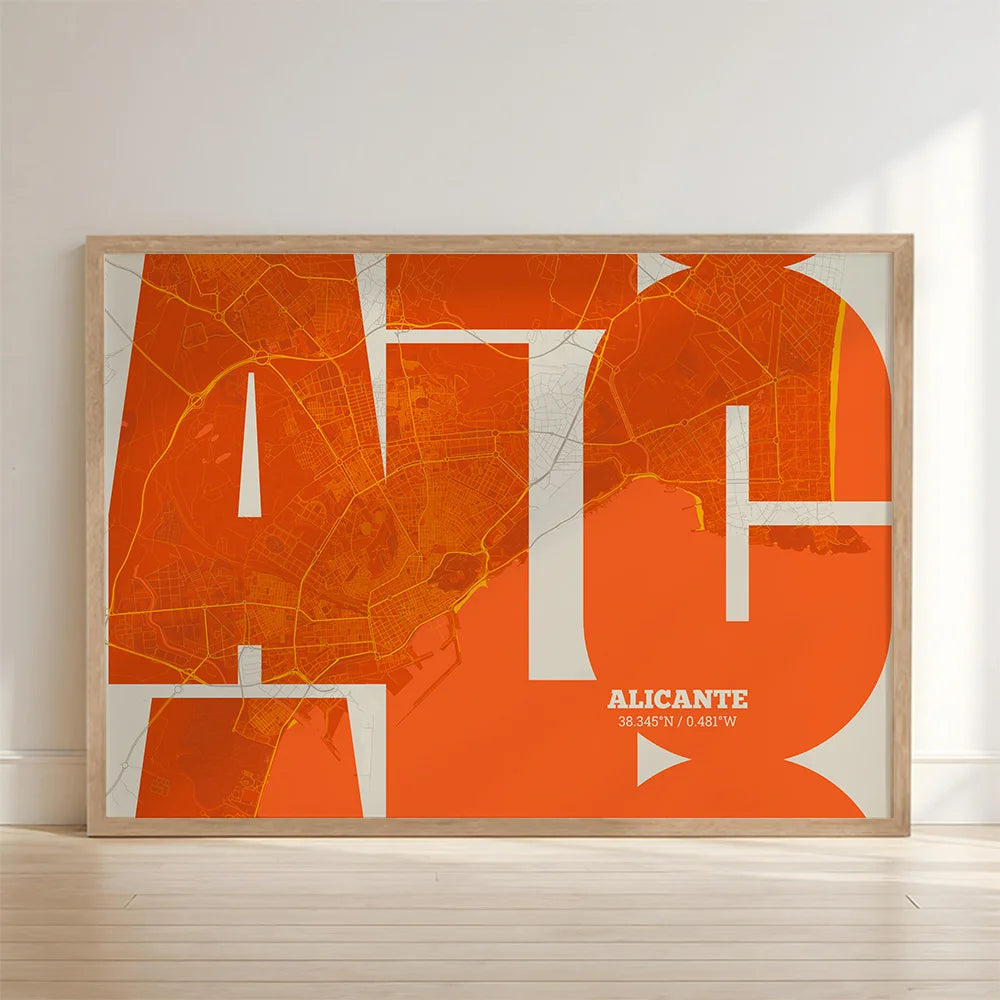 Framed Alicante in Inseparable design, featuring the city's abbreviation in expressive typography over a detailed urban map designed in orange and an off-white background with no border edge-to-edge print leaning against a wall