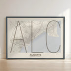 Framed Alicante in Ultralight design, a minimalist aesthetic combining urban cartography with modern, extra-thin elegant lettering designed in light brown and an off-white background with no border edge-to-edge print leaning against a wall