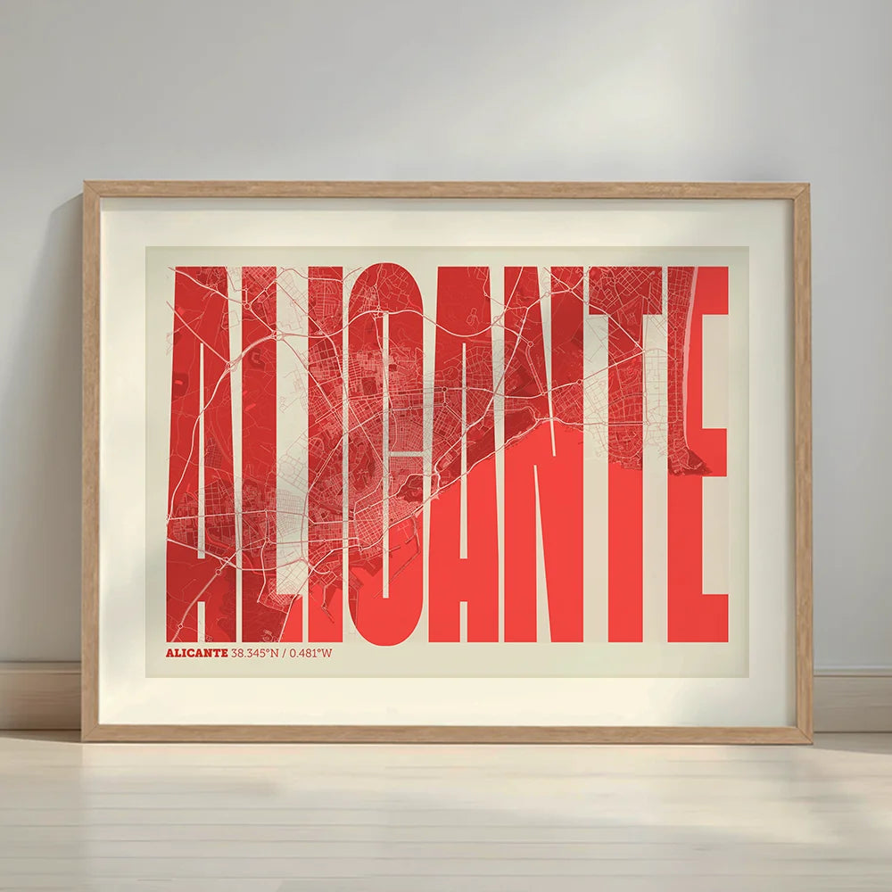Framed Alicante in Extra Compressed design, where the letters are tightly squeezed to fit the city's map shape designed in red and an off-white background with a white margin border in a warm lit minimalist setting