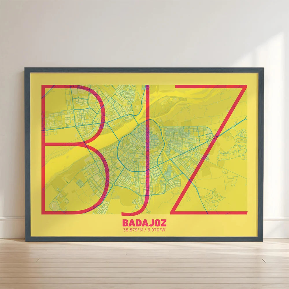 Framed Badajoz in Ultralight design, a minimalist aesthetic combining urban cartography with modern, extra-thin elegant lettering designed in yellow and fuchsia with no border edge-to-edge print leaning against a wall