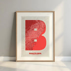 Framed Barcelona in Super Bold design, a typographic poster where the city map is overlaid with extra-thick lettering for a modern, high-impact look designed in red and an off-white background with a white margin border in a warm lit minimalist setting