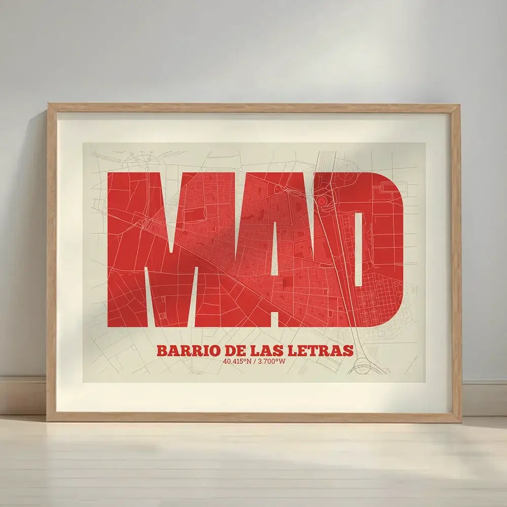 Framed Barrio de Las Letras in Super Bold design, a typographic poster where the city map is overlaid with extra-thick lettering for a modern, high-impact look designed in red and an off-white background with a white margin border in a warm lit minimalist setting