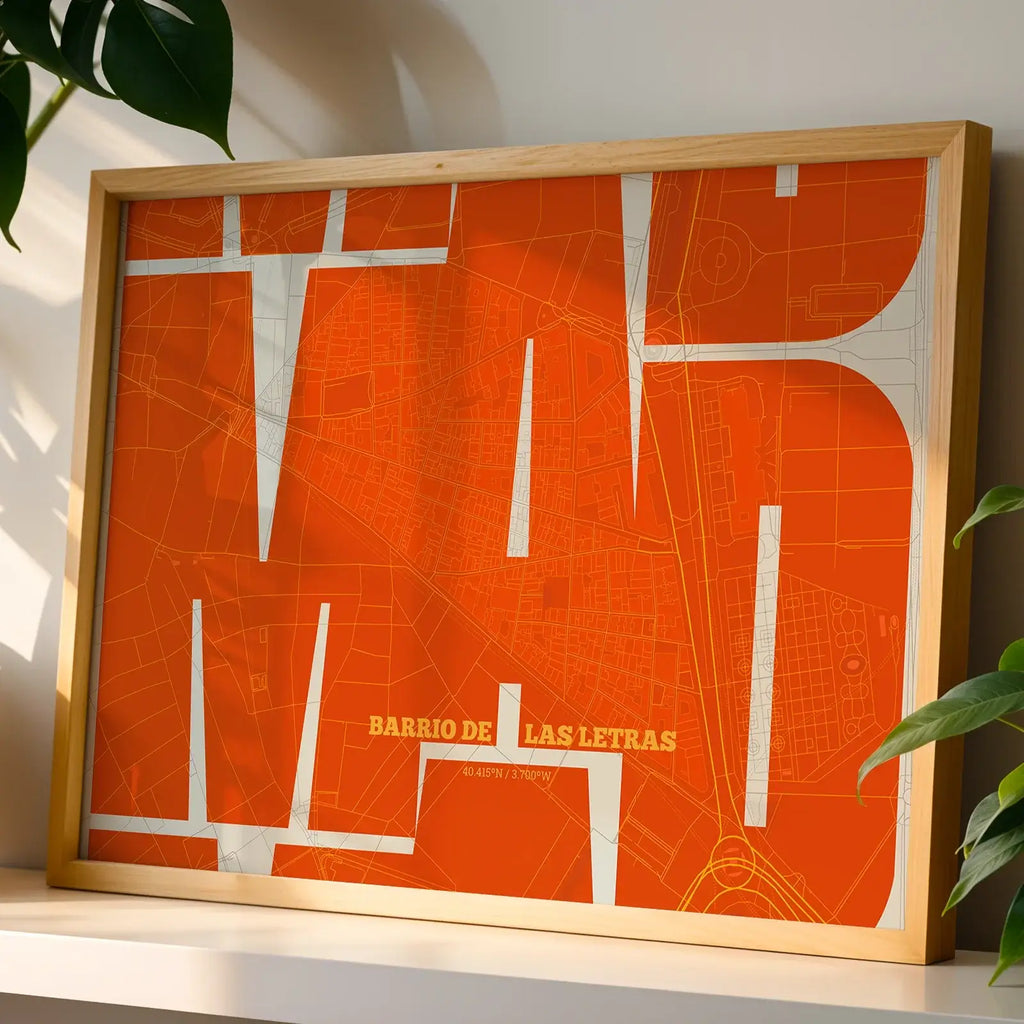 Modern interior design with a Barrio de Las Letras in Inseparable design, featuring the city's abbreviation in expressive typography over a detailed urban map designed in orange and an off-white background, displayed on a living room wall
