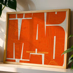 Modern interior design with a Barrio de Las Letras in Inseparable design, featuring the city's abbreviation in expressive typography over a detailed urban map designed in orange and an off-white background, displayed on a living room wall