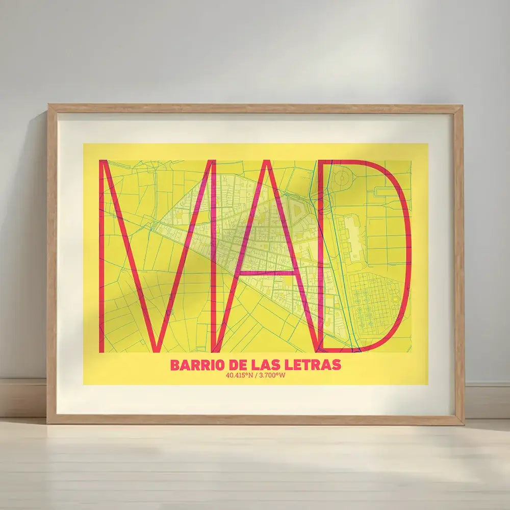 Framed Barrio de Las Letras in Ultralight design, a minimalist aesthetic combining urban cartography with modern, extra-thin elegant lettering designed in yellow and fuchsia with a white margin border in a warm lit minimalist setting