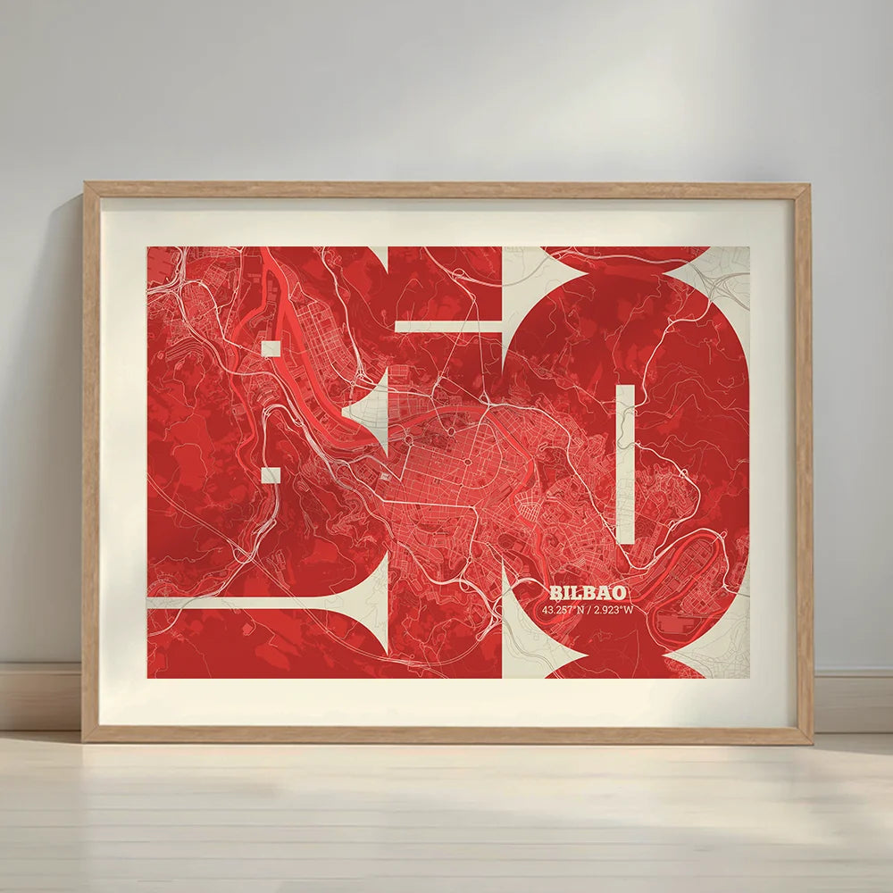 Framed Bilbao in Inseparable design, featuring the city's abbreviation in expressive typography over a detailed urban map designed in red and an off-white background with a white margin border in a warm lit minimalist setting