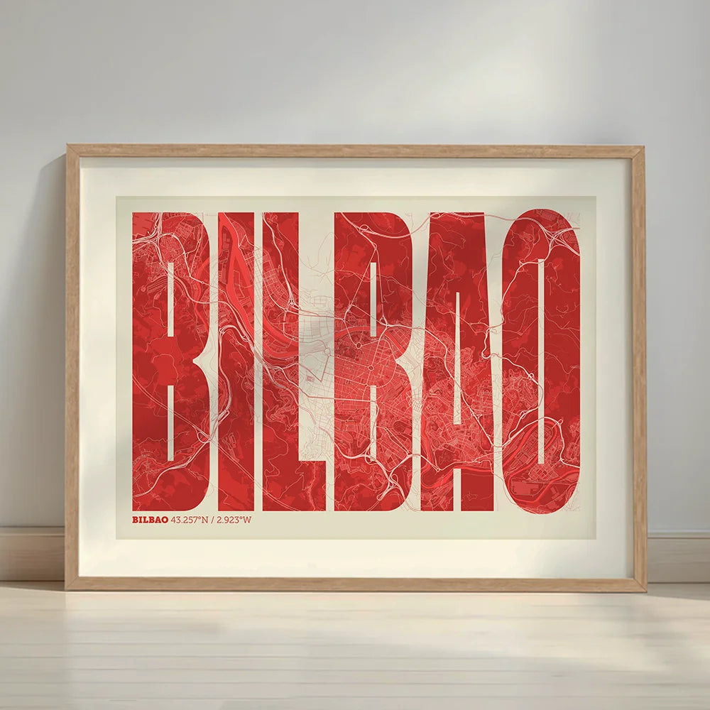 Framed Bilbao in Extra Compressed design, where the letters are tightly squeezed to fit the city's map shape designed in red and an off-white background with a white margin border in a warm lit minimalist setting