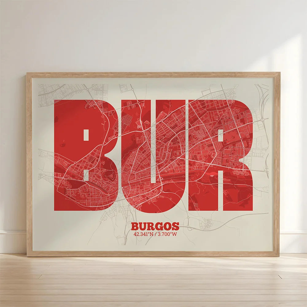 Framed Burgos in Super Bold design, a typographic poster where the city map is overlaid with extra-thick lettering for a modern, high-impact look designed in red and an off-white background with no border edge-to-edge print leaning against a wall