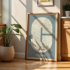 Modern interior design with a Caceres in Super Bold design, a typographic poster where the city map is overlaid with extra-thick lettering for a modern, high-impact look designed in bluish gray and an off-white background, displayed on a living room wall