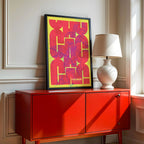 Modern interior design with a Caceres in Inseparable design, featuring the city's abbreviation in expressive typography over a detailed urban map designed in yellow and fuchsia, displayed on a living room wall