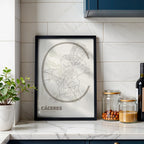 Modern interior design with a Caceres in Ultralight design, a minimalist aesthetic combining urban cartography with modern, extra-thin elegant lettering designed in light brown and an off-white background, displayed on a living room wall