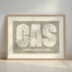Framed Castellon in Super Bold design, a typographic poster where the city map is overlaid with extra-thick lettering for a modern, high-impact look designed in light brown and an off-white background with a white margin border in a warm lit minimalist setting