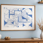 Modern interior design with a Castellon in Inseparable design, featuring the city's abbreviation in expressive typography over a detailed urban map designed in navy blue and white, displayed on a living room wall
