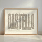 Framed Castellon in Extra Compressed design, where the letters are tightly squeezed to fit the city's map shape designed in light brown and an off-white background with a white margin border in a warm lit minimalist setting