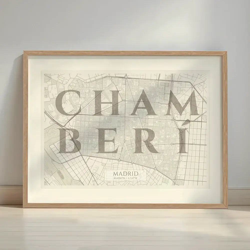 Framed Chamberi in Classic design, inspired by chiseled typography with an elegant font that creates a beautiful visual contrast designed in light brown and an off-white background with a white margin border in a warm lit minimalist setting