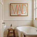 Modern interior design with a Chamberi in Ultralight design, a minimalist aesthetic combining urban cartography with modern, extra-thin elegant lettering designed in orange and an off-white background, displayed on a living room wall