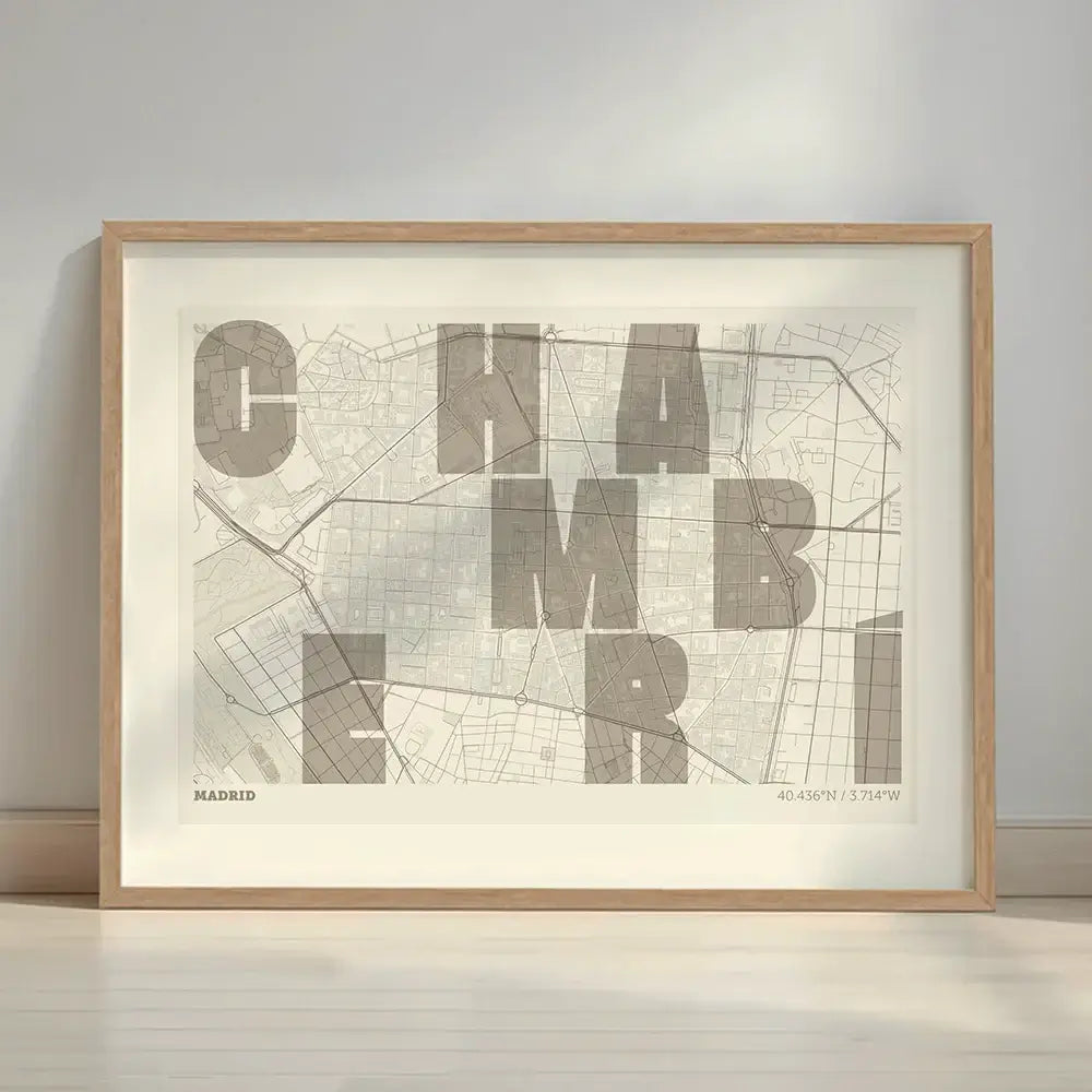 Framed Chamberi in Unruled design, where the city name letters appear randomly across different lines for a truly original urban layout designed in light brown and an off-white background with a white margin border in a warm lit minimalist setting