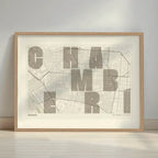 Framed Chamberi in Unruled design, where the city name letters appear randomly across different lines for a truly original urban layout designed in light brown and an off-white background with a white margin border in a warm lit minimalist setting