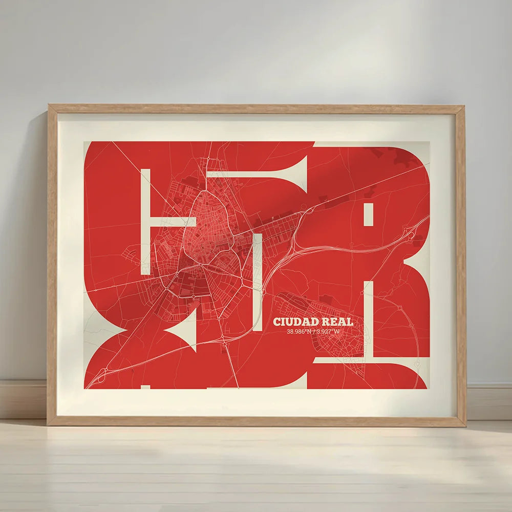 Framed Ciudad Real in Inseparable design, featuring the city's abbreviation in expressive typography over a detailed urban map designed in red and an off-white background with a white margin border in a warm lit minimalist setting