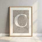 Framed Cuenca in Classic design, inspired by chiseled typography with an elegant font that creates a beautiful visual contrast designed in light brown and an off-white background with a white margin border in a warm lit minimalist setting