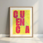 Framed Cuenca in Unruled design, where the city name letters appear randomly across different lines for a truly original urban layout designed in yellow and fuchsia with a white margin border in a warm lit minimalist setting