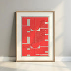 Framed Fuerteventura in Inseparable design, featuring the city's abbreviation in expressive typography over a detailed urban map designed in red and an off-white background with a white margin border in a warm lit minimalist setting