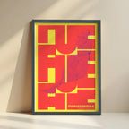 Framed Fuerteventura in Inseparable design, featuring the city's abbreviation in expressive typography over a detailed urban map designed in yellow and fuchsia with no border edge-to-edge print leaning against a wall