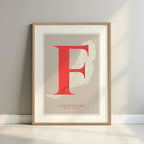 Framed Fuerteventura in Classic design, inspired by chiseled typography with an elegant font that creates a beautiful visual contrast designed in red and an off-white background with a white margin border in a warm lit minimalist setting