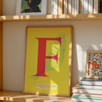 Modern interior design with a Fuerteventura in Classic design, inspired by chiseled typography with an elegant font that creates a beautiful visual contrast designed in yellow and fuchsia, displayed on a living room wall