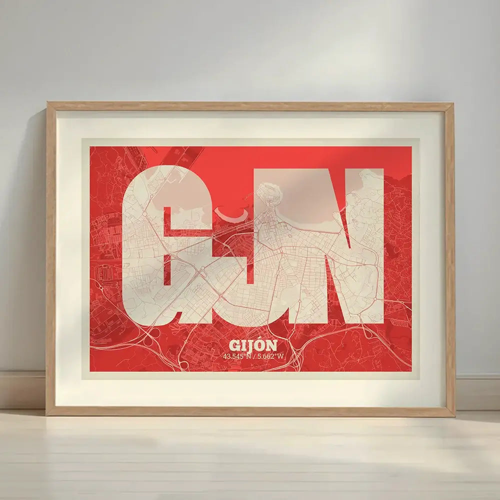 Framed Gijon in Super Bold design, a typographic poster where the city map is overlaid with extra-thick lettering for a modern, high-impact look designed in red and an off-white background with a white margin border in a warm lit minimalist setting