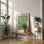 Modern interior design with a Girona in Inseparable design, featuring the city's abbreviation in expressive typography over a detailed urban map designed in two green tones, displayed on a living room wall