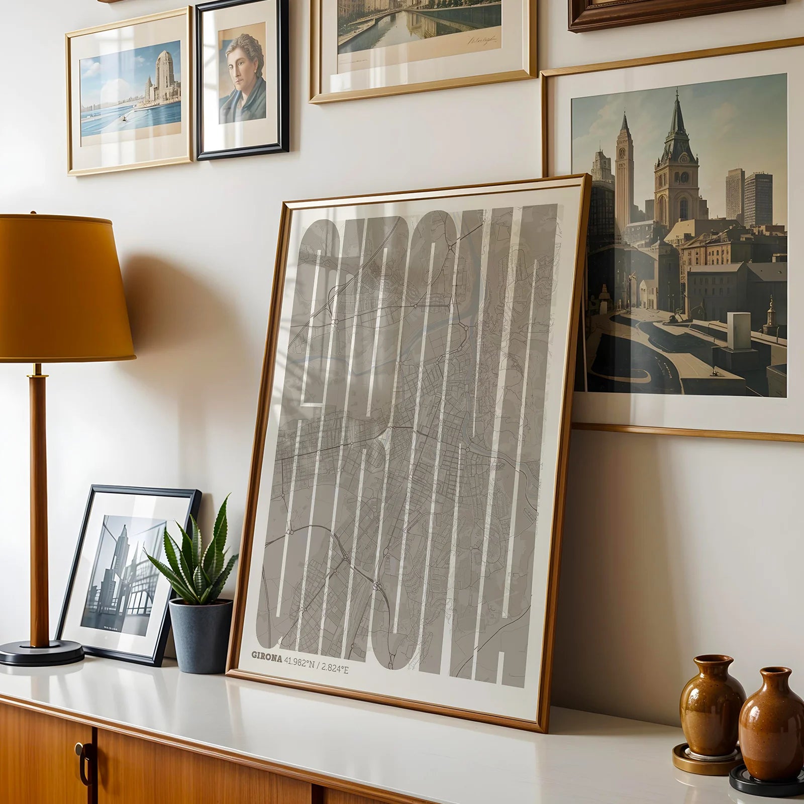 Modern interior design with a Girona in Extra Compressed design, where the letters are tightly squeezed to fit the city's map shape designed in light brown and an off-white background, displayed on a living room wall