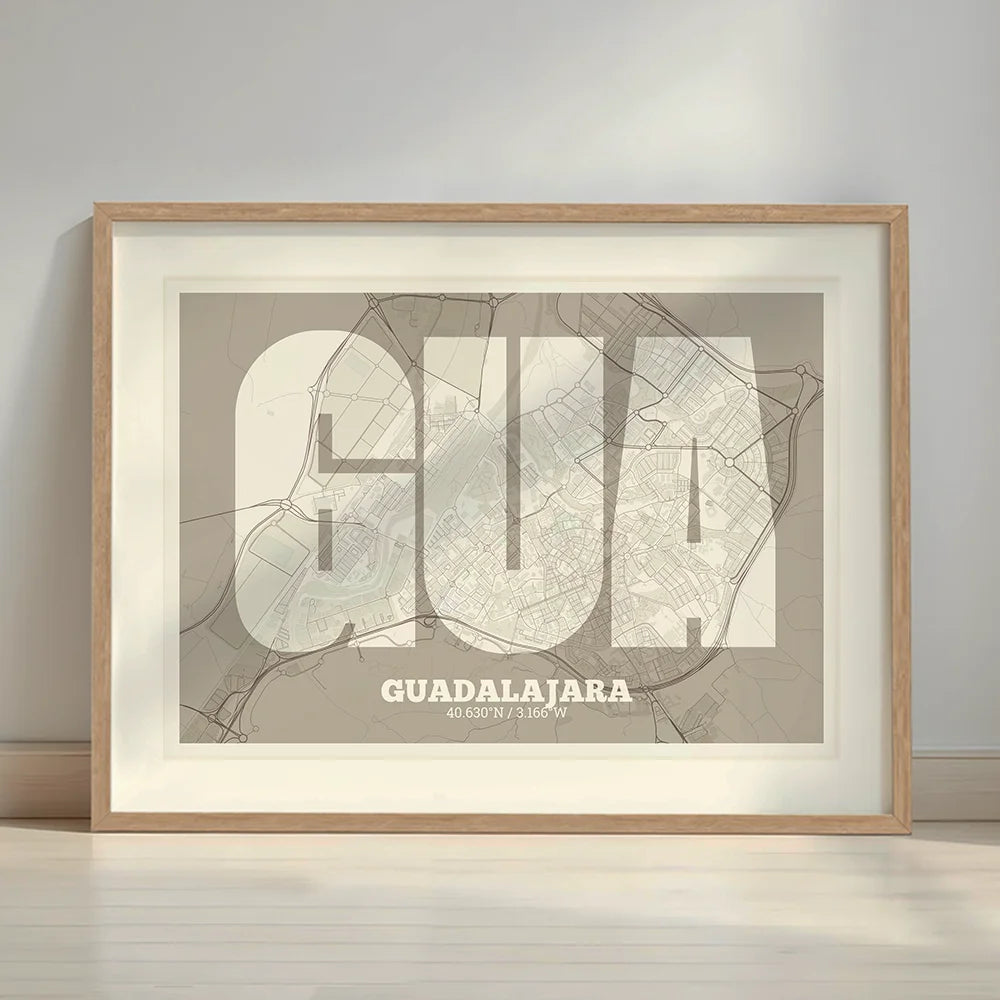 Framed Guadalajara in Super Bold design, a typographic poster where the city map is overlaid with extra-thick lettering for a modern, high-impact look designed in light brown and an off-white background with a white margin border in a warm lit minimalist setting