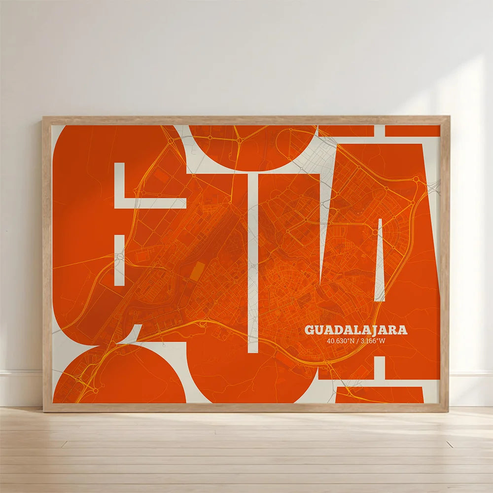 Framed Guadalajara in Inseparable design, featuring the city's abbreviation in expressive typography over a detailed urban map designed in orange and an off-white background with no border edge-to-edge print leaning against a wall