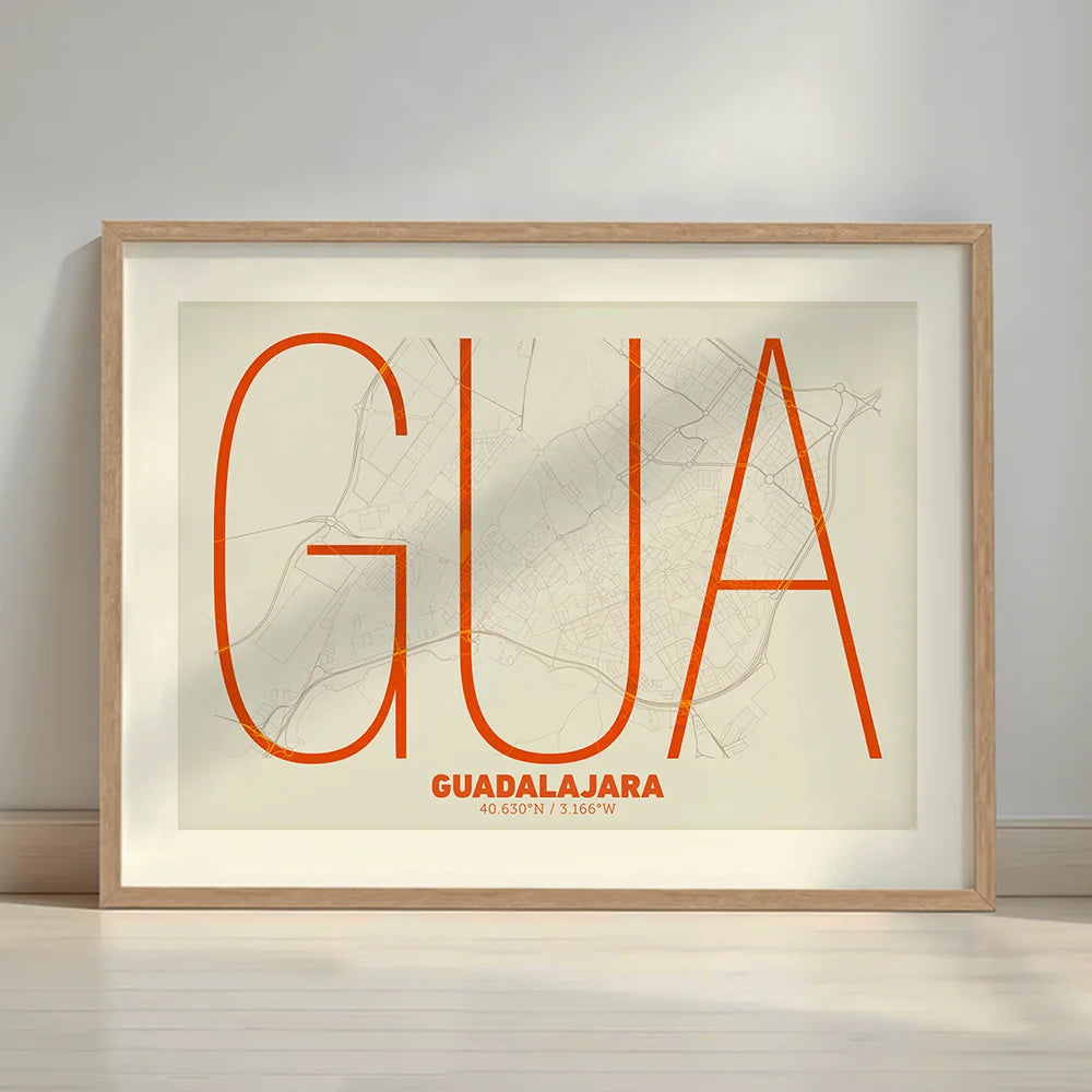 Framed Guadalajara in Ultralight design, a minimalist aesthetic combining urban cartography with modern, extra-thin elegant lettering designed in orange and an off-white background with a white margin border in a warm lit minimalist setting