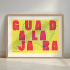 Framed Guadalajara in Unruled design, where the city name letters appear randomly across different lines for a truly original urban layout designed in yellow and fuchsia with a white margin border in a warm lit minimalist setting