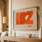 Modern interior design with a Ibiza in Super Bold design, a typographic poster where the city map is overlaid with extra-thick lettering for a modern, high-impact look designed in orange and an off-white background, displayed on a living room wall