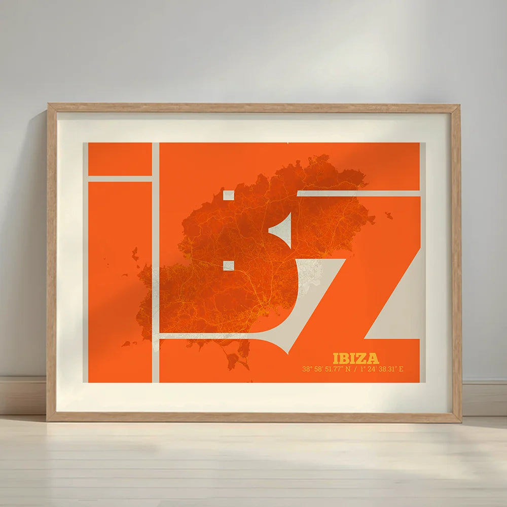 Framed Ibiza in Inseparable design, featuring the city's abbreviation in expressive typography over a detailed urban map designed in orange and an off-white background with a white margin border in a warm lit minimalist setting