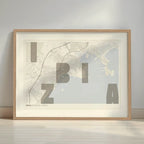 Framed Ibiza in Unruled design, where the city name letters appear randomly across different lines for a truly original urban layout designed in light brown and an off-white background with a white margin border in a warm lit minimalist setting