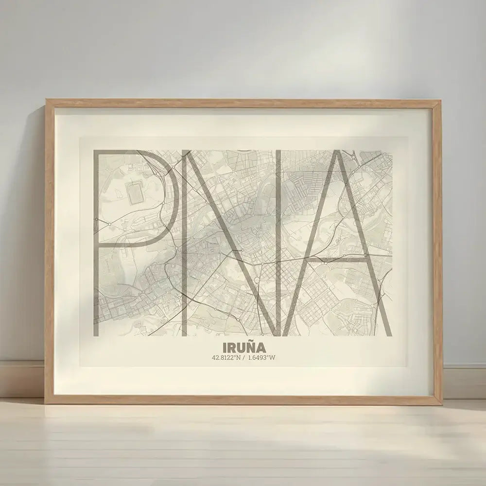 Framed Iruña in Ultralight design, a minimalist aesthetic combining urban cartography with modern, extra-thin elegant lettering designed in light brown and an off-white background with a white margin border in a warm lit minimalist setting