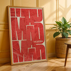 Modern interior design with a La Latina, Madrid, in Inseparable design, featuring the city's abbreviation in expressive typography over a detailed urban map designed in red and an off-white background, displayed on a living room wall