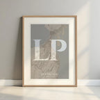 Framed Las Palmas in Classic design, inspired by chiseled typography with an elegant font that creates a beautiful visual contrast designed in light brown and an off-white background with a white margin border in a warm lit minimalist setting
