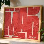 Modern interior design with a Lavapies, Madrid, in Inseparable design, featuring the city's abbreviation in expressive typography over a detailed urban map designed in red and an off-white background, displayed on a living room wall