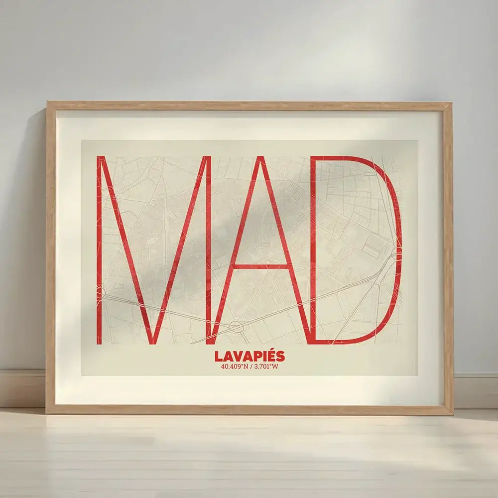 Framed Lavapies, Madrid, in Ultralight design, a minimalist aesthetic combining urban cartography with modern, extra-thin elegant lettering designed in red and an off-white background with a white margin border in a warm lit minimalist setting