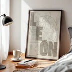 Modern interior design with a Leon in Unruled design, where the city name letters appear randomly across different lines for a truly original urban layout designed in light brown and an off-white background, displayed on a living room wall