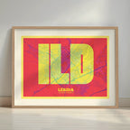 Framed Lerida in Super Bold design, a typographic poster where the city map is overlaid with extra-thick lettering for a modern, high-impact look designed in yellow and fuchsia with a white margin border in a warm lit minimalist setting